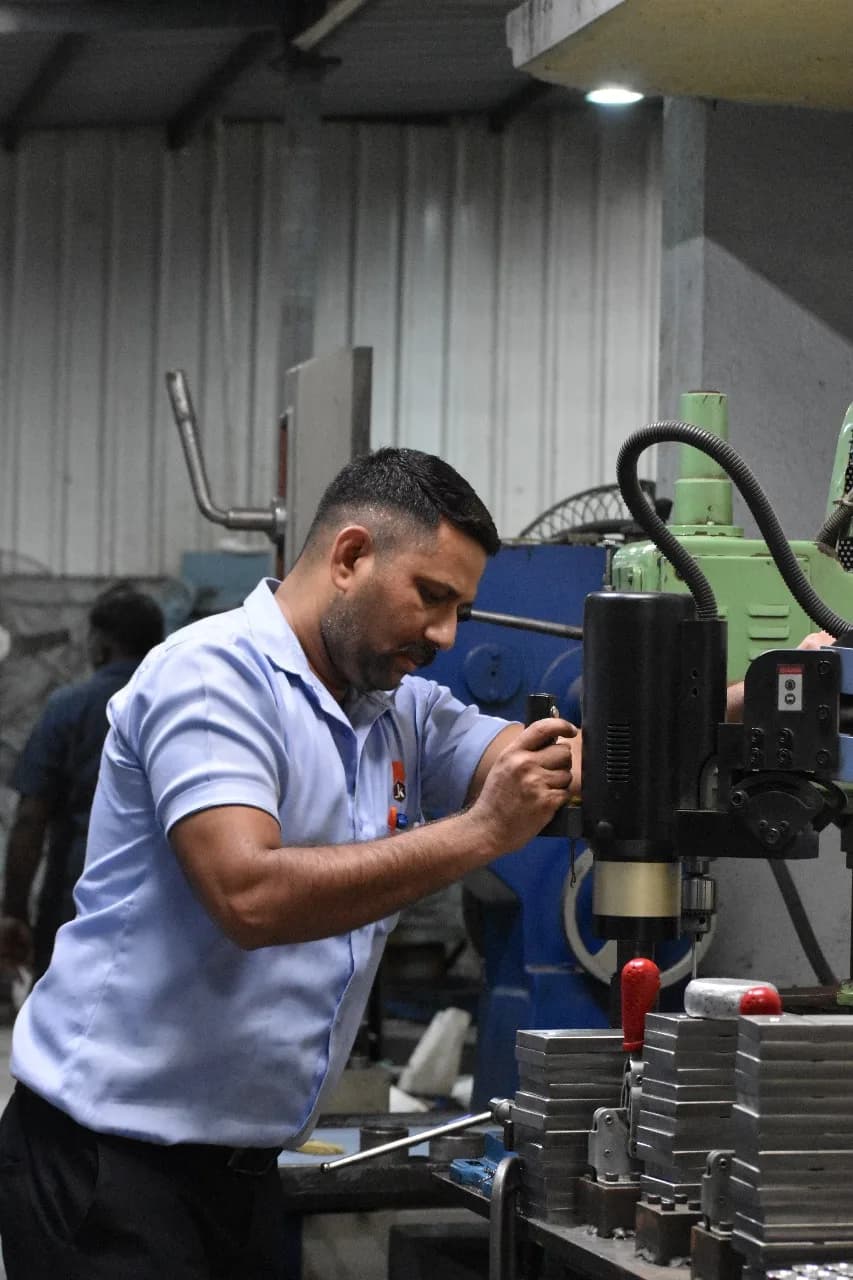 KK Industries operator working at precision machine